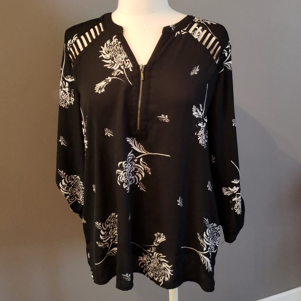 Beautifully flowy top with cutouts